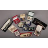 A collection of cased costume jewellery items. Beads, necklaces and brooches etc.