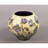 A Moorcroft small vase, In the Hepatica pattern by Emma Bassoms, approx 12 cm high with box