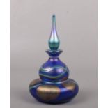 An iridescent Ditchfield style glass scent bottle and stopper. Signed Okra 92, 13.5cm. Good