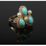 A 14ct gold, turquoise and pearl cocktail ring with unusual hinged shank. 10.8 grams gross. Size R