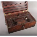 A 19th century Anglo Indian teak metal bound campaign writing box. With fitted interior having