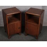 A pair of oak bedside cabinets, 72cm high, 37cm wide, 35cm deep. Scuffs and scratches to the