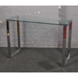 A modern chrome and glass rectangular hall table, 40cm x 110cm, 76cm high.
