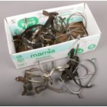 A box of horse stirrups.