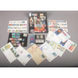 A collection of stamps including some mint examples and first day covers. World and Commonwealth.