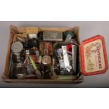 A stencilled wooden crate and assorted collectables including lighters, vintage advertising tins and