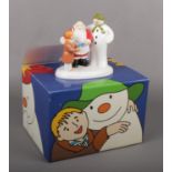 A boxed Coalport Characters figure group. The Snowman and Father Christmas, Special Gift, fist