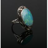 A silver, Art Nouveau style opal doublet ring. Size M.