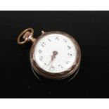 A silver and silver gilt miniature fob watch. Engraved and with enamel dial. Stamped 800, 27mm wide.