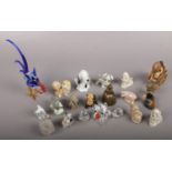 A quantity of mostly miniature animals to include ceramic and glass examples.