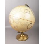 A Replogle 12 inch diameter globe on stand.