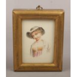 A Regency vignette portrait miniature of a girl in gilt frame, 8.5cm x 6cm.