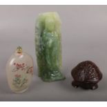 A jade coloured carving formed as Guanyin along with a wooden trinket box formed as a nut and a