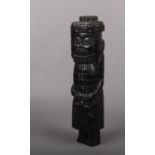 An African carved hardwood tribal statue, possibly ebony, 33cm.
