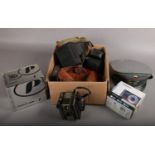 A box of cameras and photographic equipment including two boxed Polaroid cameras, Coronet Twelve