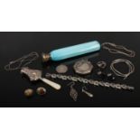 A box of silver oddments including a babies rattle, compact, marcasite bracelet and an opaque blue