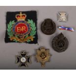 A quantity of army cap badges to include Royal army service, enamelled silver example etc.