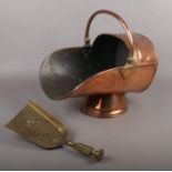A Copper Coal Scuttle with brass shovel.