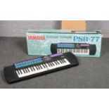 A Yamaha PSR-77 Portatone Keyboard with stand