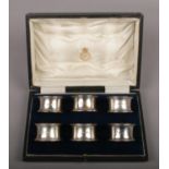 A cased set of 6 George V silver serviette rings by Thomas Bradbury & Sons Ltd. Assayed Sheffield
