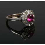 A 9ct gold and silver cluster ring set with pink and white paste stones. Size N.