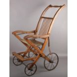 An Edwardian folding pushchair.