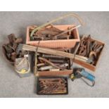 A large collection of vintage hand tools. Including wood working and mechanics, blow lamps, grease