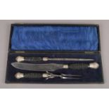 A Homing pigeon carving set with antler handles with white metal mount and collar, in original box.
