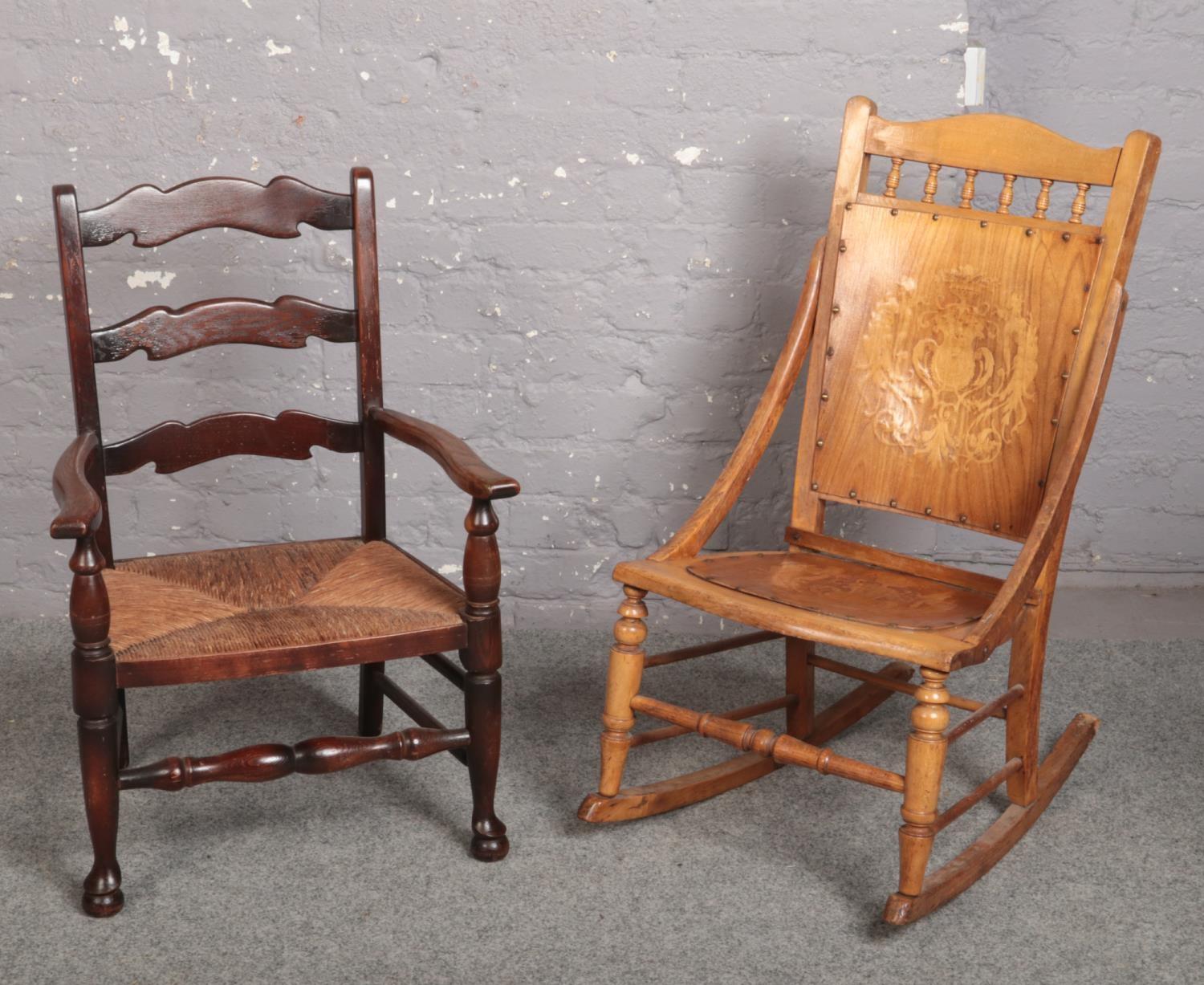 A 1920s rocking chair and a ladder back rush seat nursing chair.