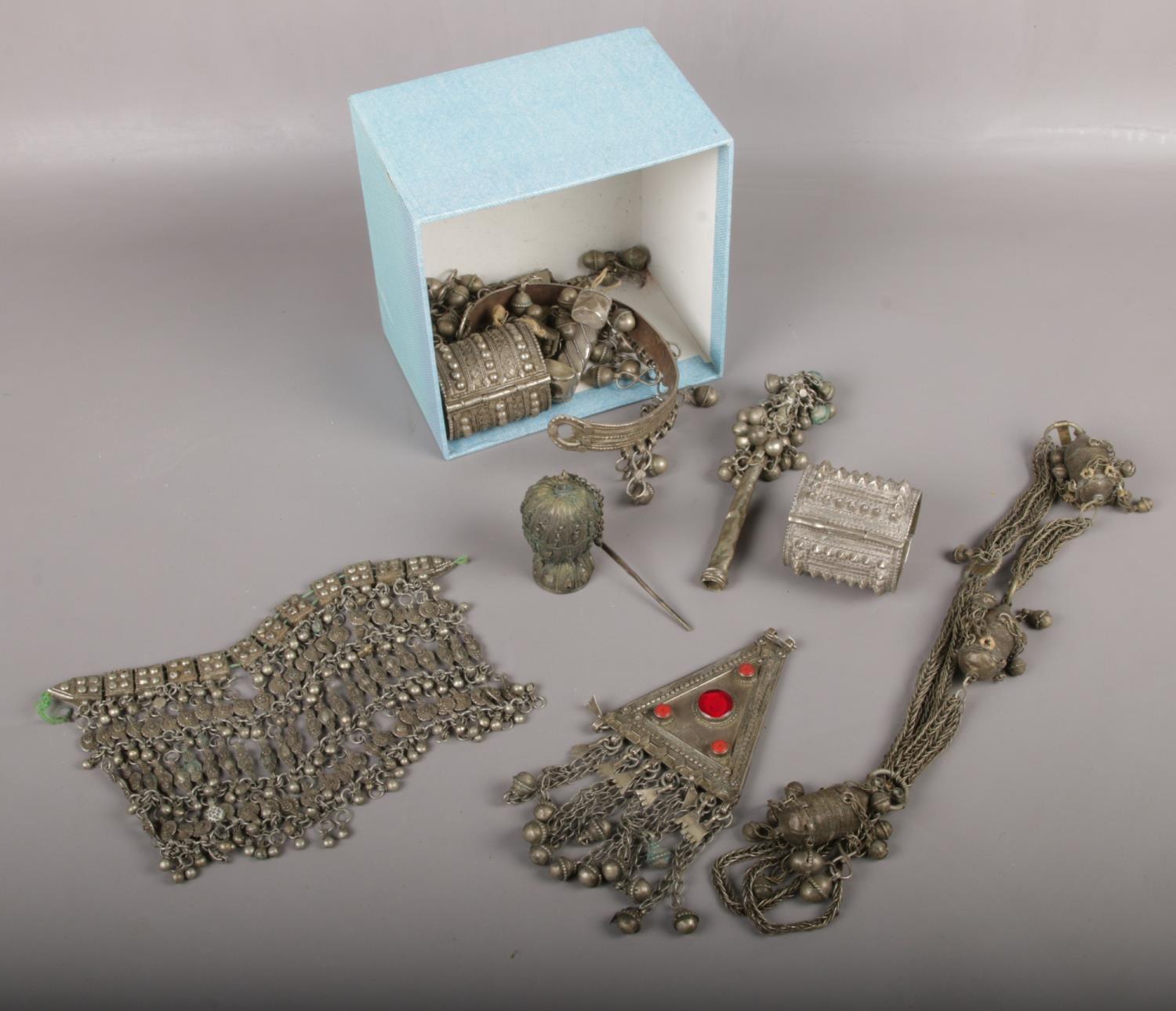 A box of eastern white metal jewellery to include bangles etc.