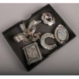 Five silver brooches to include Victorian example etc.