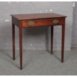 A Georgian mahogany single drawer side table raised on square supports, 76cm wide, 45.5cm deep, 76cm