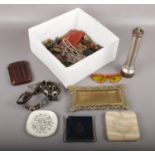 A box of collectables to include flash light, metal trinket dish, sunglasses, leather collars etc.
