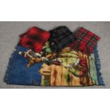 Three tartan blankets, to include Spinney, along with an Eastern wool rug.