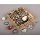 A box of approximately 50 dress rings to include white and coloured paste stone examples etc.