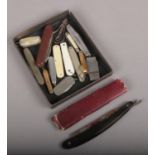 A tray of pocket knives and cut throat razor etc.