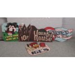 Four vintage wooden fairground signs.