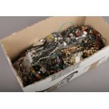 A box of costume jewellery to include beads, bangles, necklaces, earrings, etc.