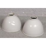 A pair of vintage industrial enamelled aluminium light shades, 46 diameter, 33cm high.