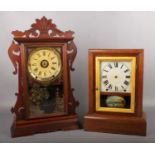 A 19th century mahogany cased gingerbread tin tang alarm clock by Seth Thomas along with another