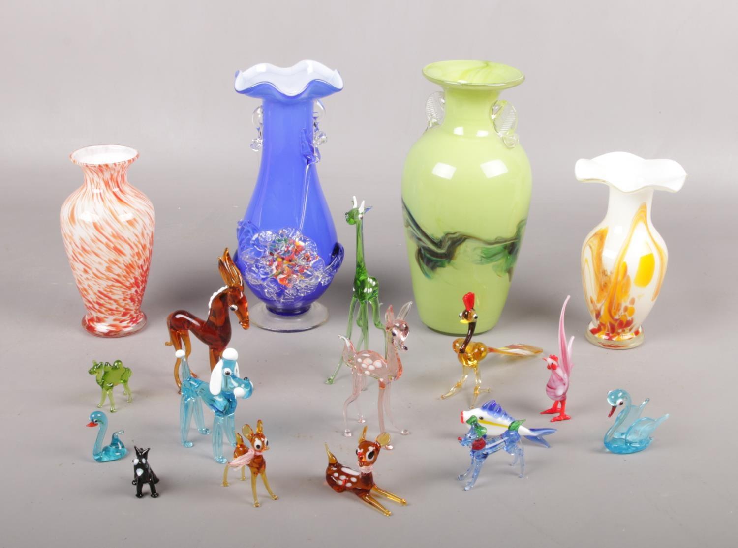 A collection of Murano glass animals, dog, deer, horse examples to include four glass vases.
