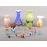 A collection of Murano glass animals, dog, deer, horse examples to include four glass vases.