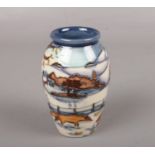 A Moorcroft pottery vase, 'Woodside farm' by Anji Davenport, approx 11 cm height with box