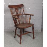 A 19th century ash and elm comb back Windsor elbow chair in the Thames valley tradition.