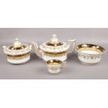 A Ridgeway part tea service. Decorated with black and putty bands, gilded with trailing leaves and