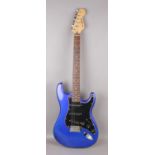 A Wesfield electric guitar in Fender Stratocaster form. With rosewood fretboard, metallic blue