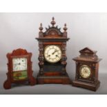 A Junghans mantel clock in simulated rosewood case striking on a gong along with two American mantel
