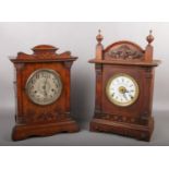 Two Victorian oak cased automatic repeating alarm clocks by Fattorini & Sons. Bradford. One with