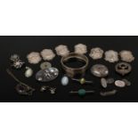 A tray of white metal and silver items including connemara brooch, Wedgwood pendants, bangle and