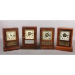 Four 19th century Seth Thomas alarm clocks in rosewood cases, 23.5cm.